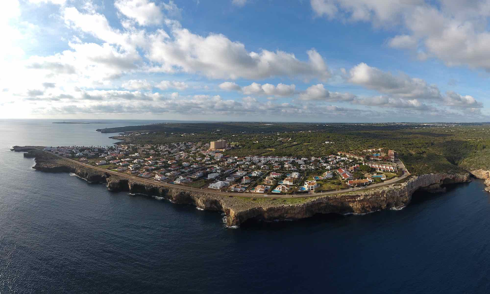 Aerial view of S'Algar in Menorca across the Marine Reserve Isla del Aire 